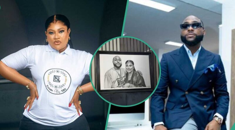 Nollywood actress Nkechi Blessing has stirred reactions by displaying a framed photo of herself and award-winning singer Davido.